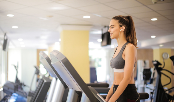 Modern commercial fitness facility with natural light, ergonomic equipment, and active recovery zone designed by Athletic Vision
