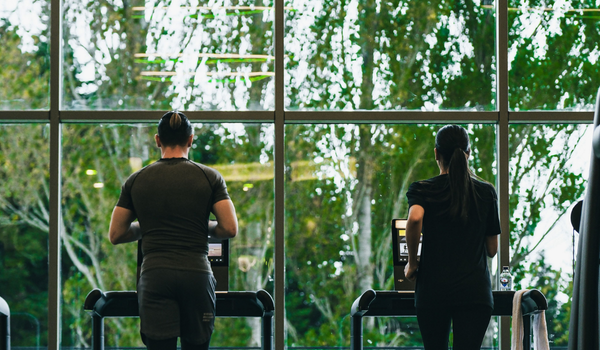 Autonomous hotel gym facility featuring intuitive commercial cardio lines and a dedicated post-travel recovery zone designed by Athletic Vision