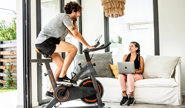 Technical comparison between mechanical cloth pad friction and magnetic resistance indoor bikes by Athletic Vision